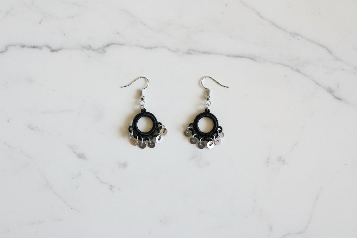 Handmade black crochet hoop dangle earrings with silver swirl charm accents, lightweight minimalist boho earrings for women