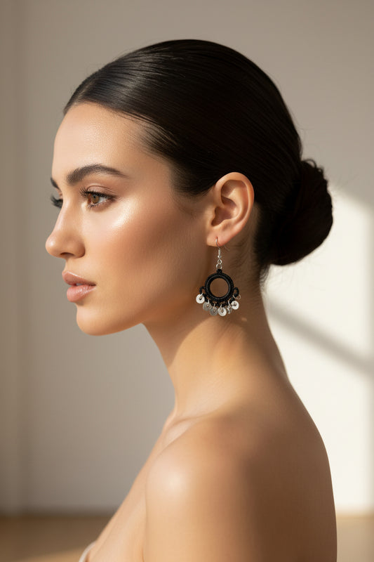 Handmade black crochet hoop dangle earrings with silver swirl charm accents, lightweight minimalist boho earrings for women