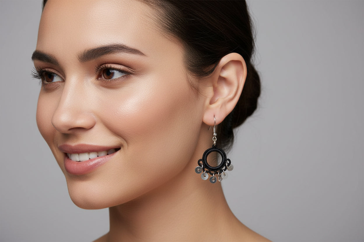 Handmade black crochet hoop dangle earrings with silver swirl charm accents, lightweight minimalist boho earrings for women
