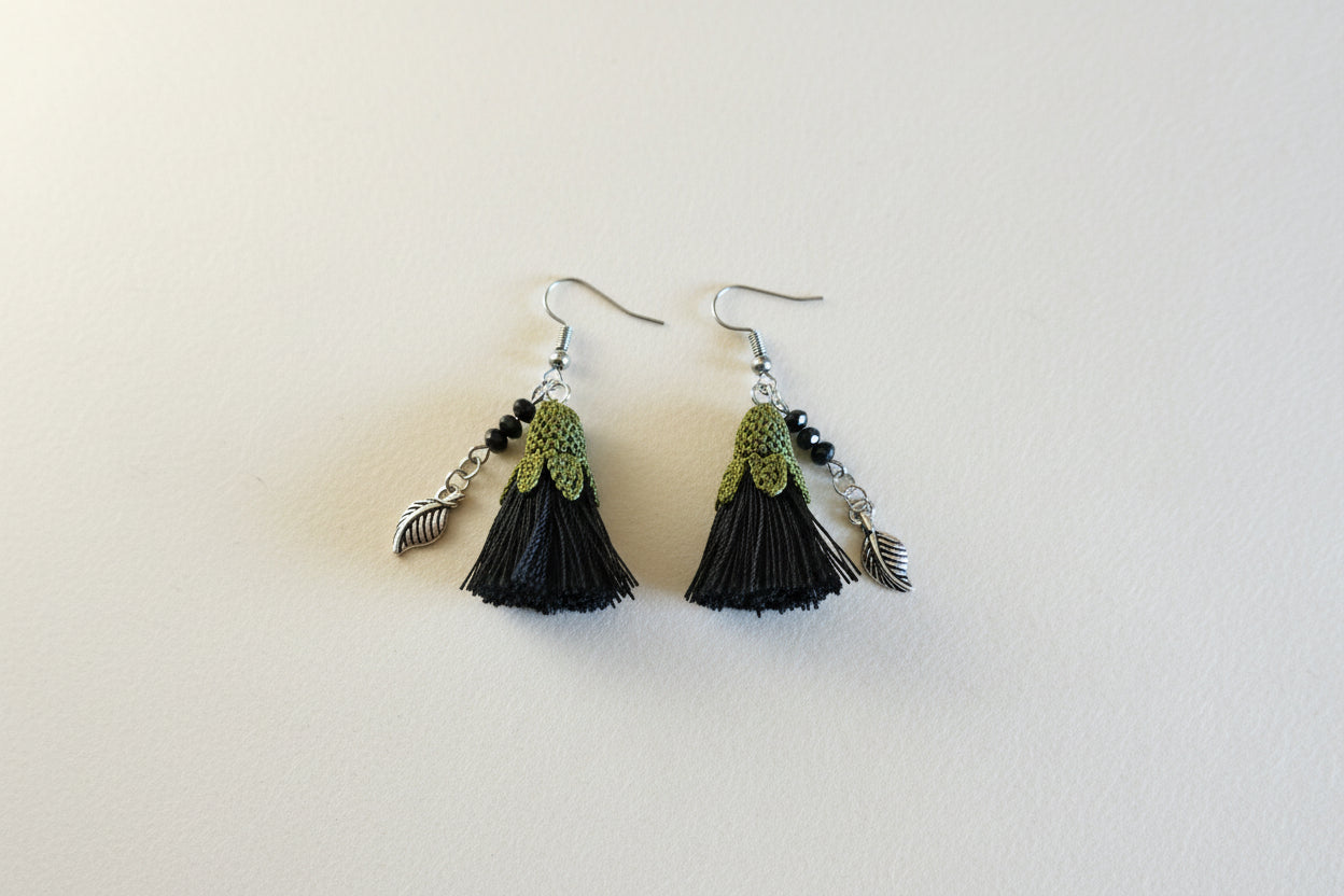 Handmade black tassel crochet dangle earrings with green crochet top and silver leaf charm, lightweight boho earrings for women